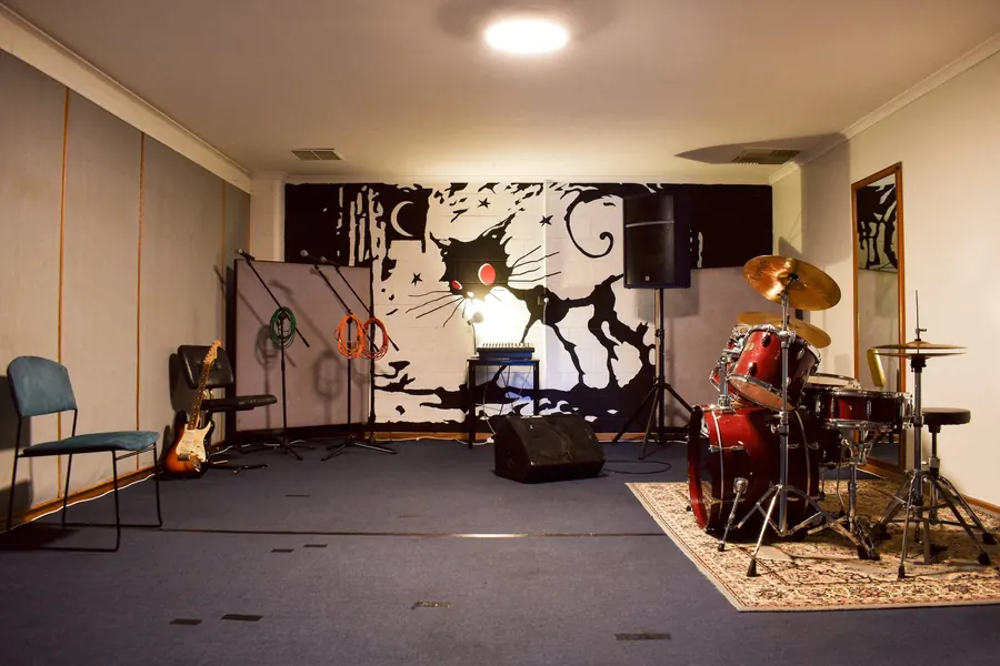 Rehearsal Room 8 at Windsor Gardens: drum kit, PA and treated walls